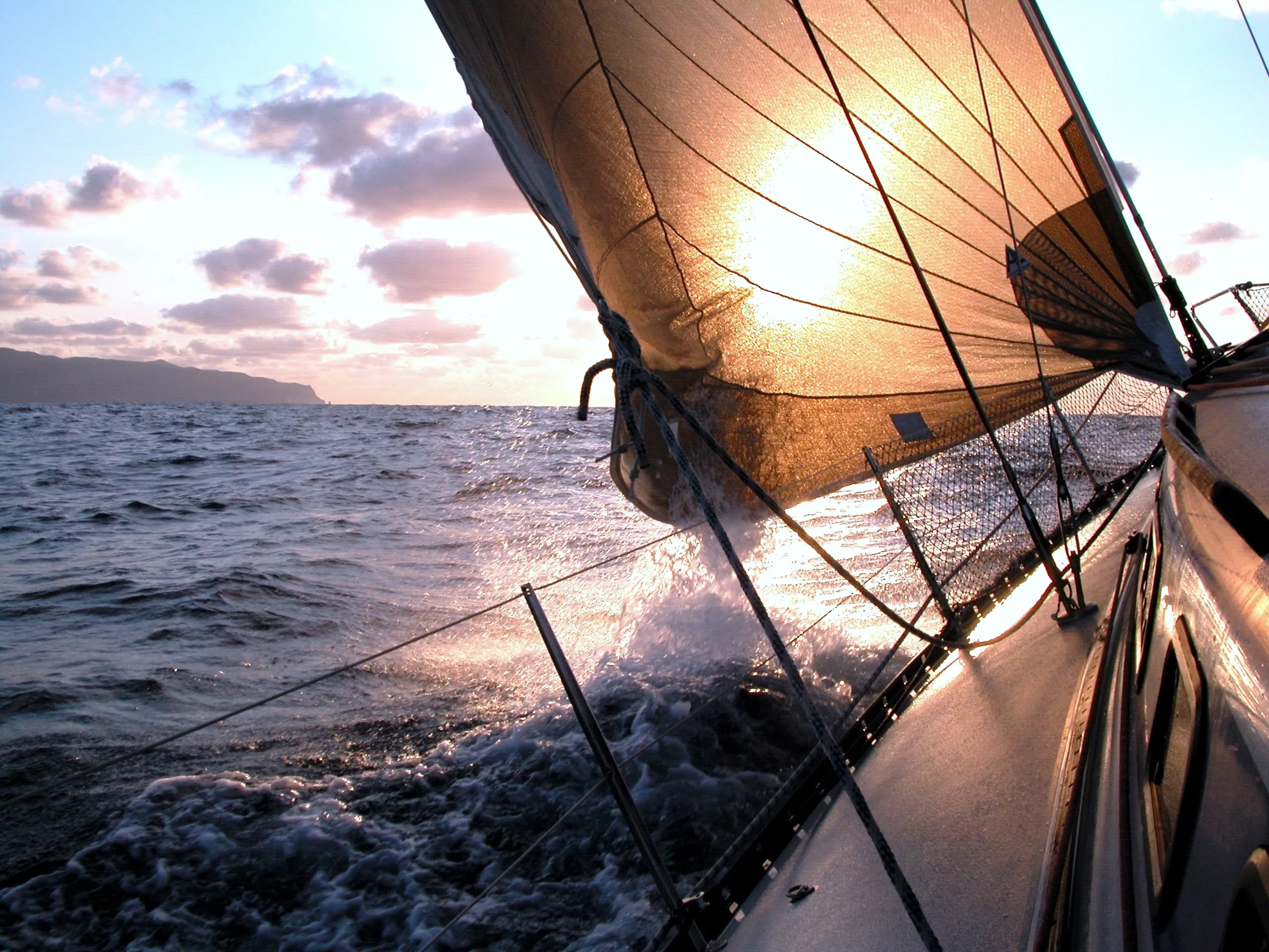 Sailing vessel at sunset